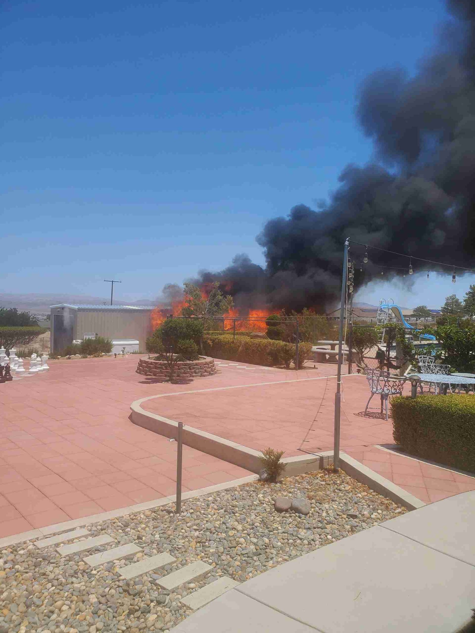 Fire damage restoration job showing heavy smoke and active flames handled by Rapid Response Flood Restoration